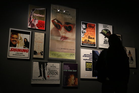 A museum-goer for Stanley Kubrick's CCCB exhibit looks at movie posters on March 31 2019 (by Mar Vila)